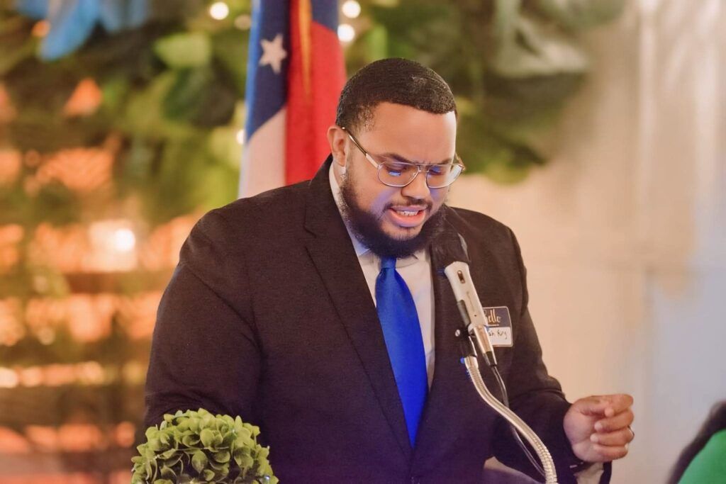 Micah King discussing voting logistics and community resources with rural Southeast Georgia residents
